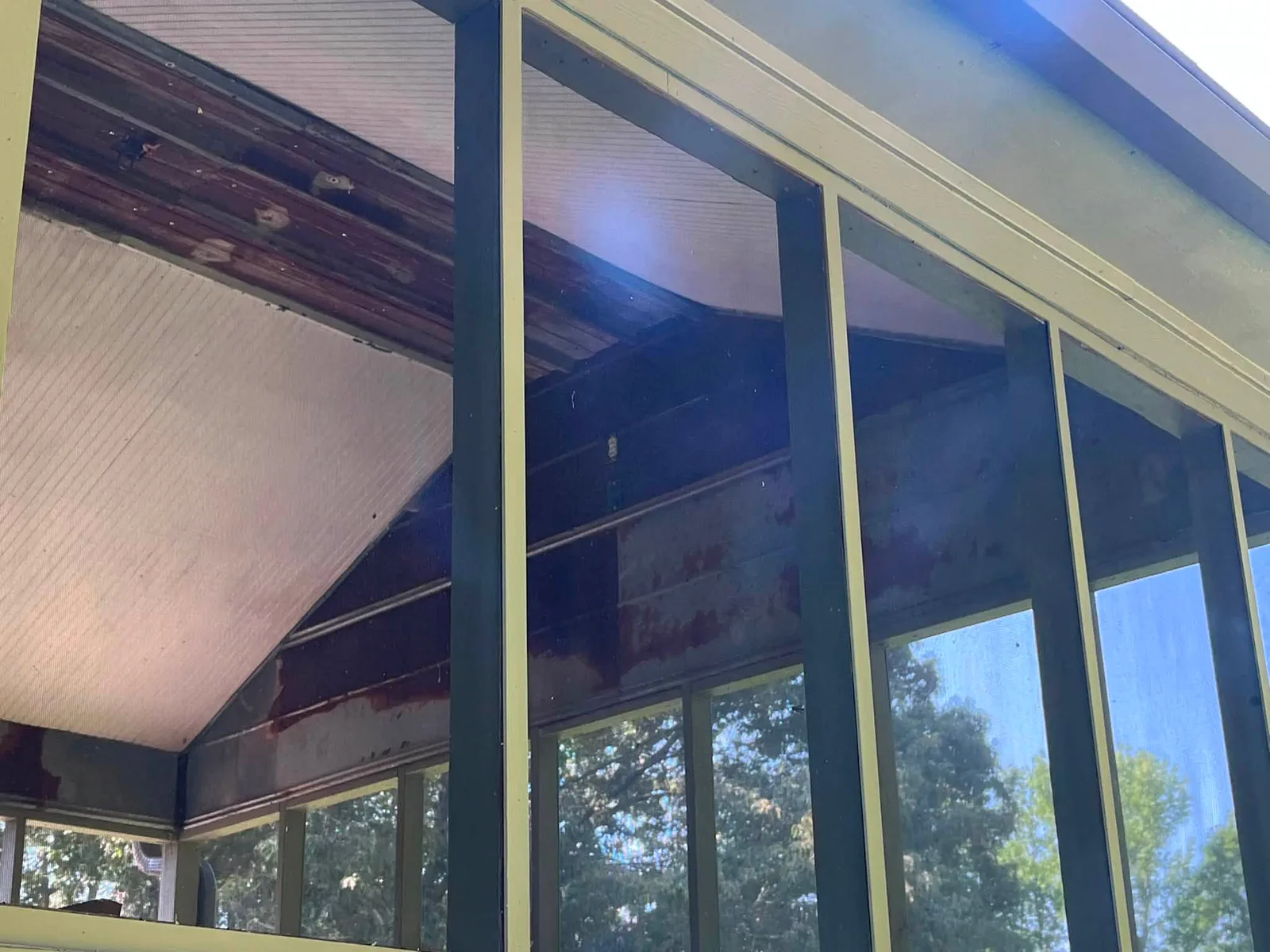 Screened porch framing during exterior painting and restoration work