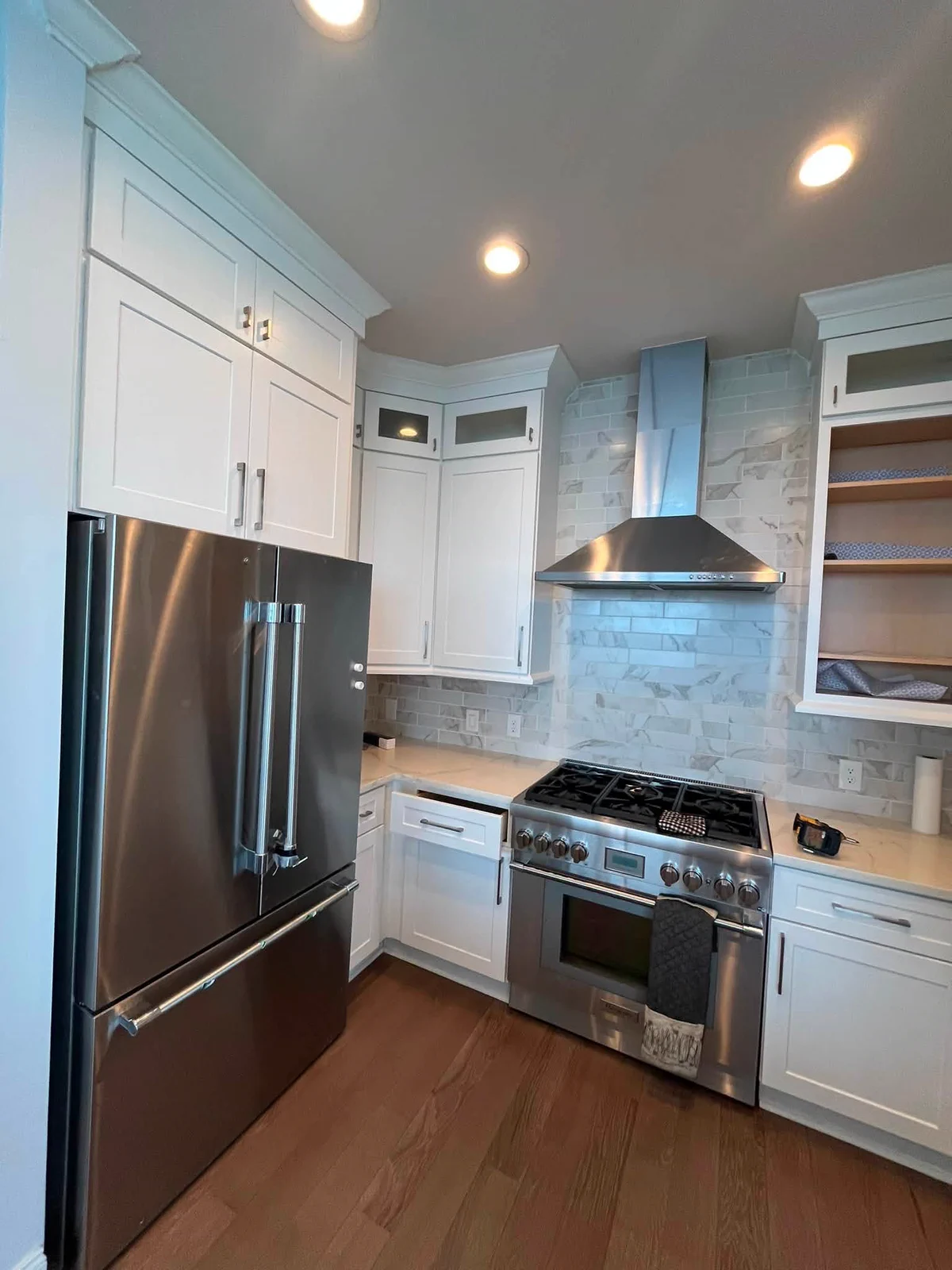 Completed white kitchen cabinets and freshly painted walls in a high-rise residence
