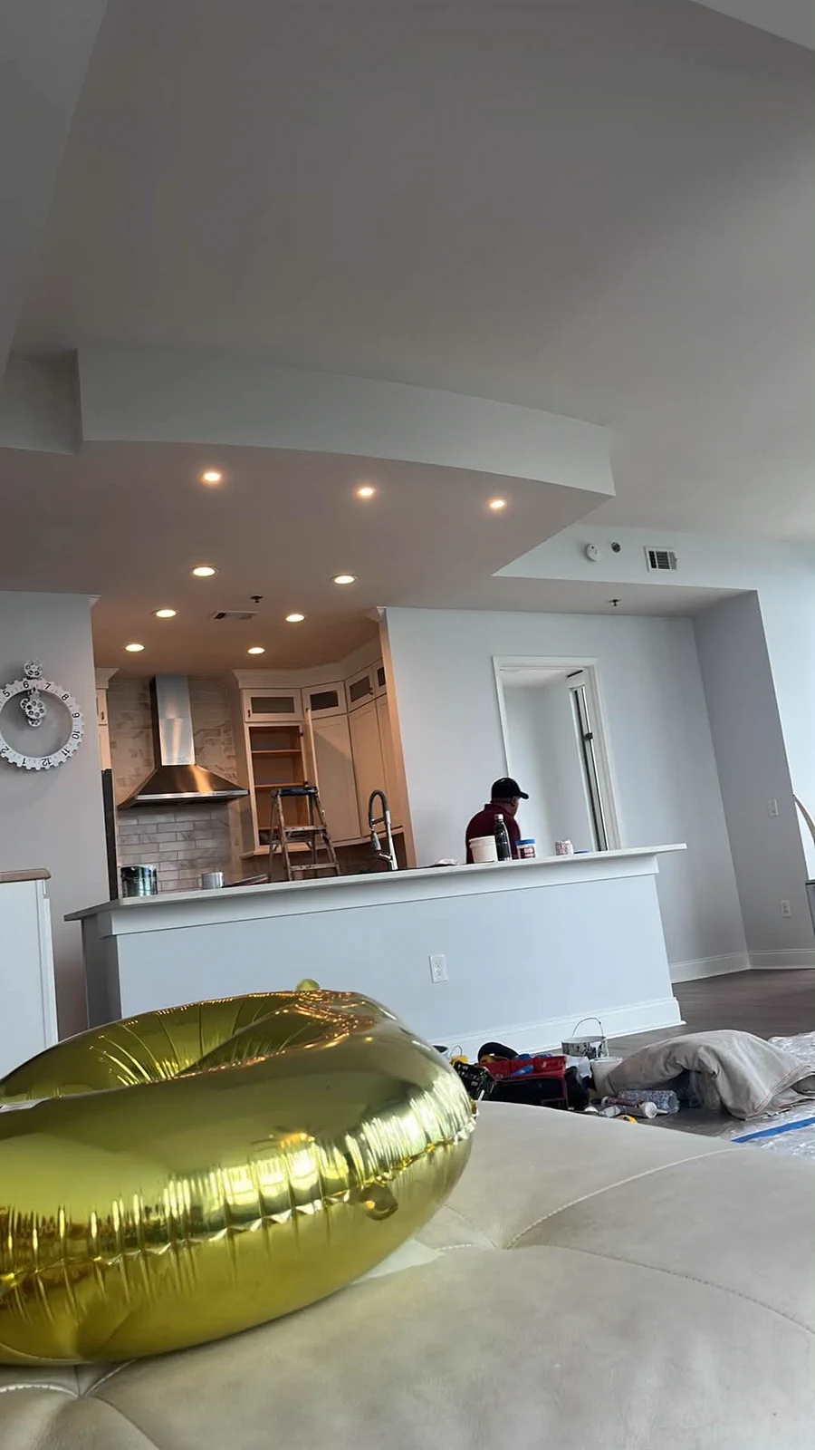 Finished open-plan living area with smooth light-gray walls