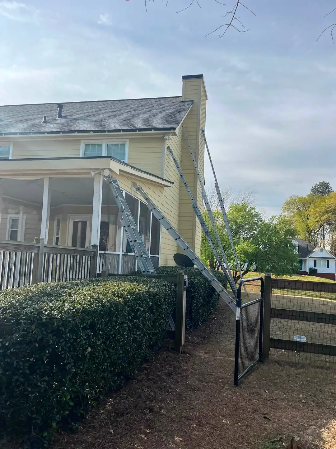 Front-side exterior before repainting the yellow siding