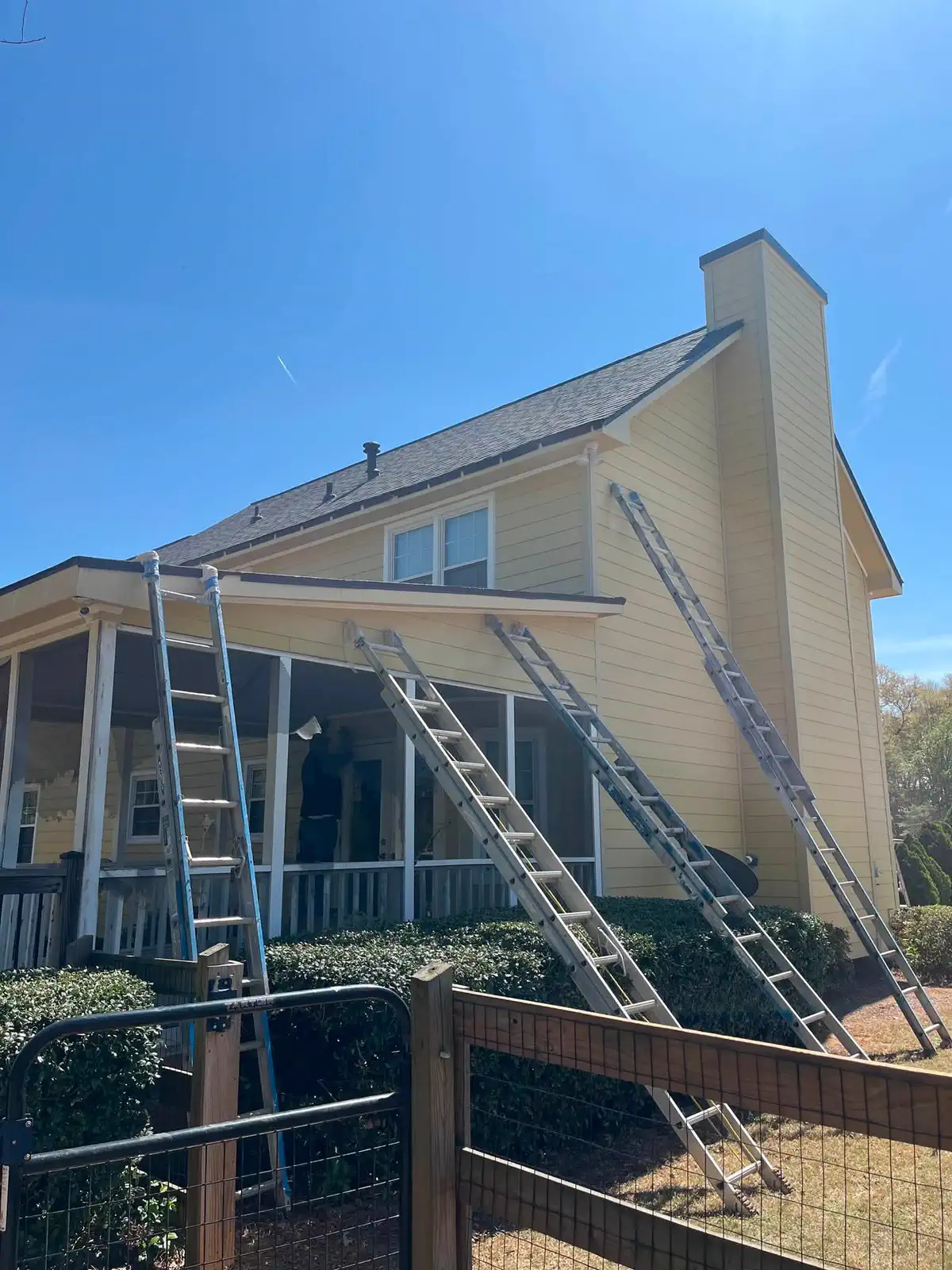 Rear exterior wall during ladder work and surface preparation