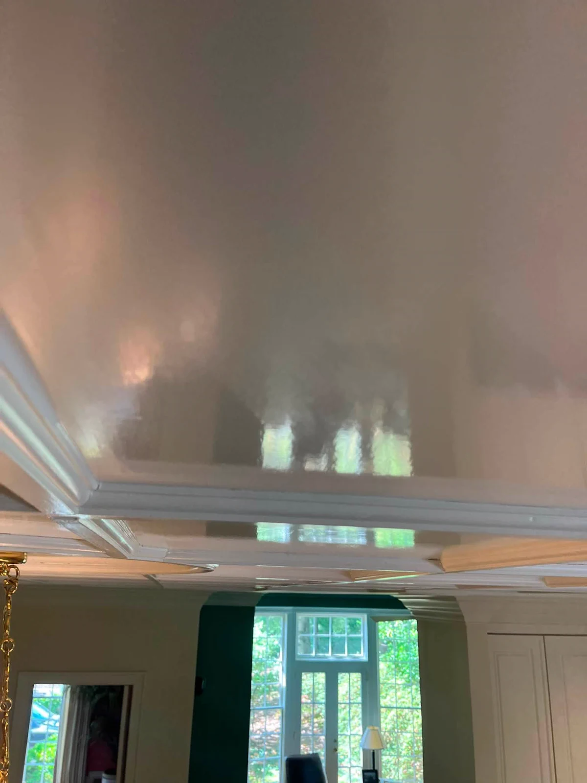 Smooth reflective ceiling finish in the completed traditional interior