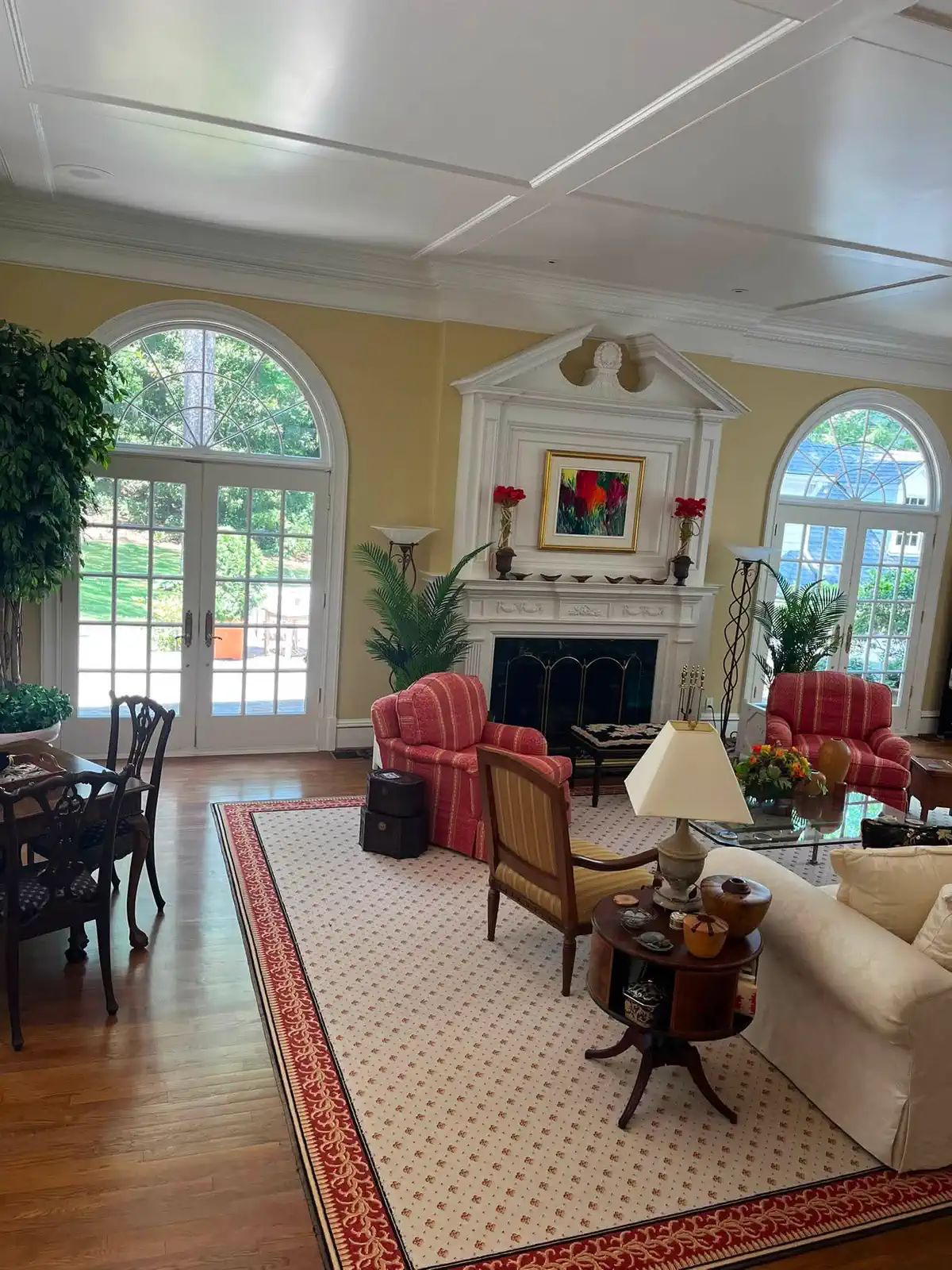 Bright finished living room with freshly painted walls and detailed white trim