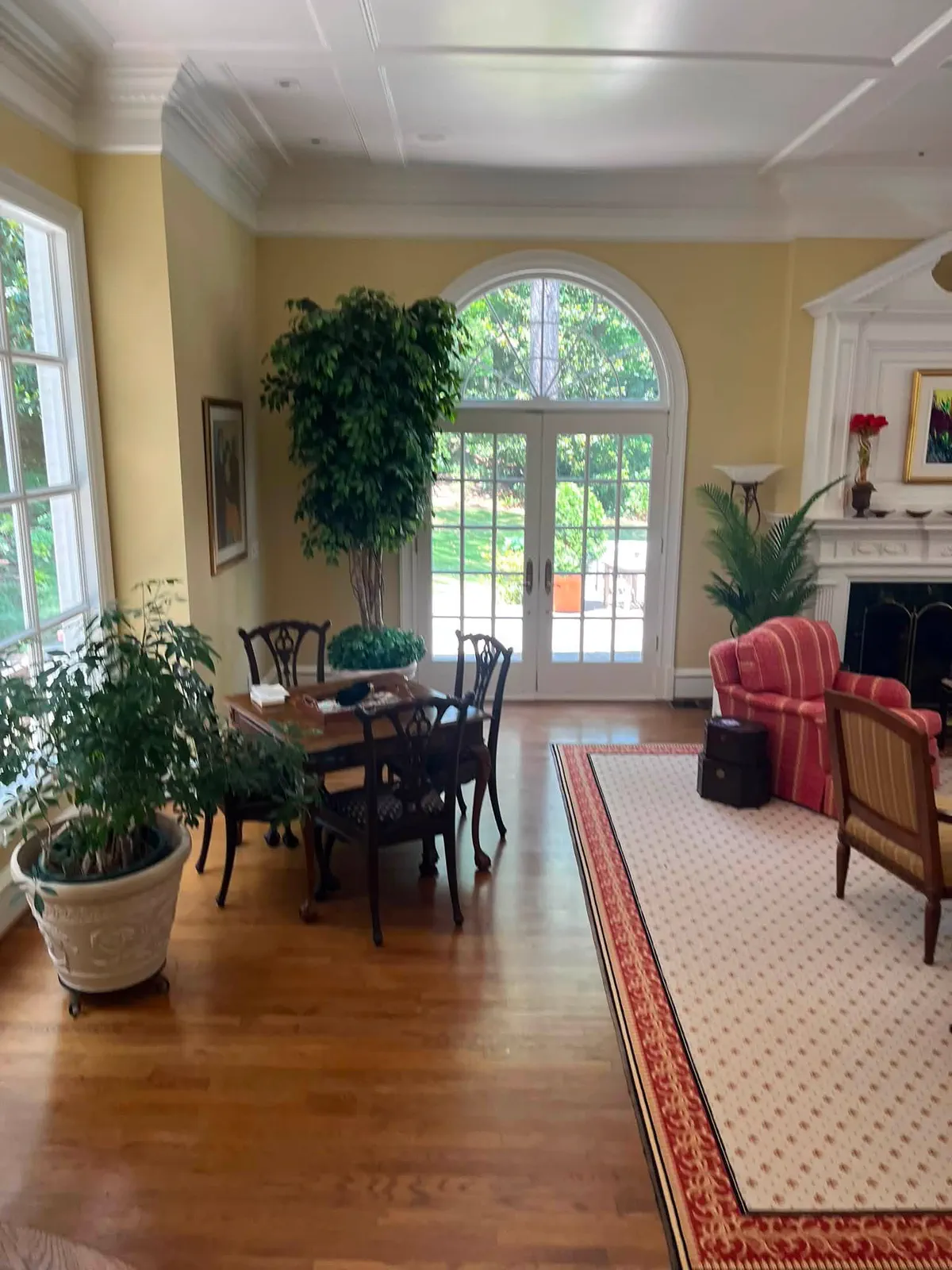 Finished main room with light walls, white trim, and restored architectural details