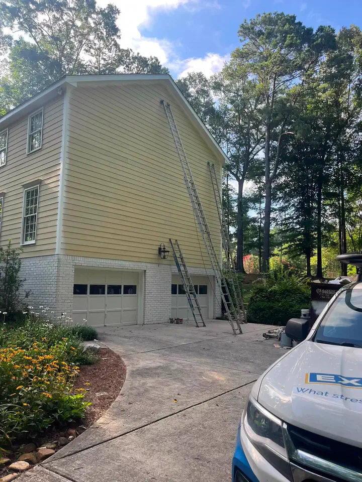 Yellow siding on the two-story home before the exterior color change